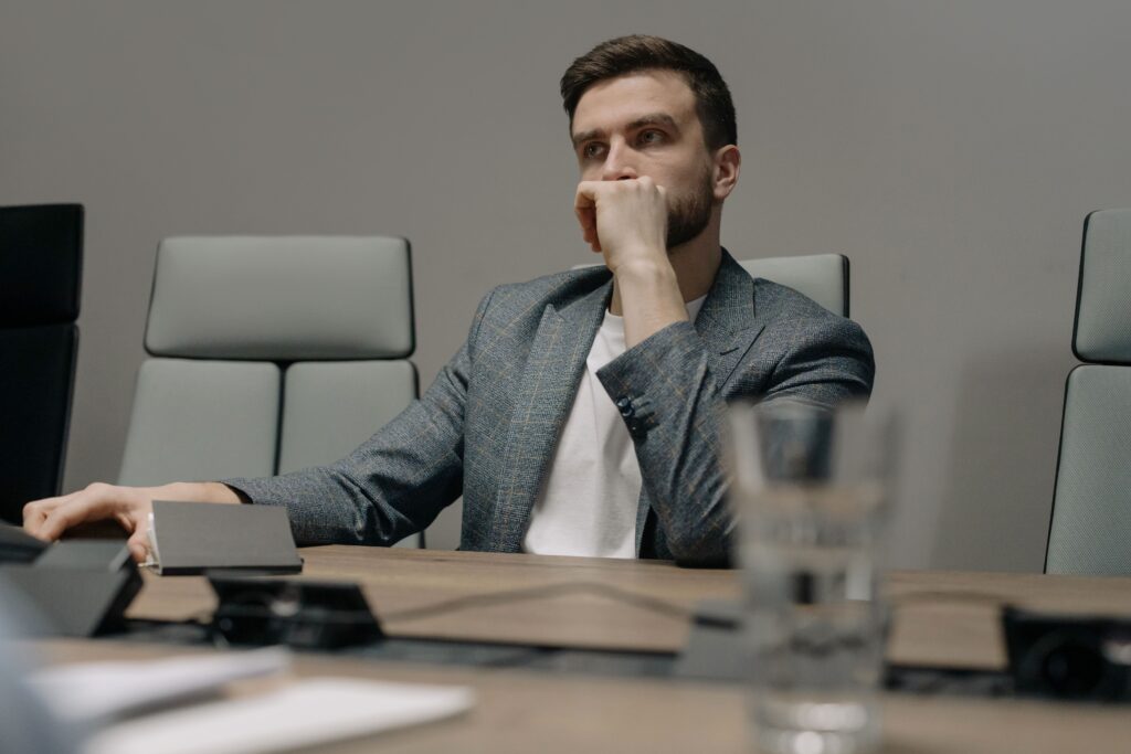 person alone in meeting room