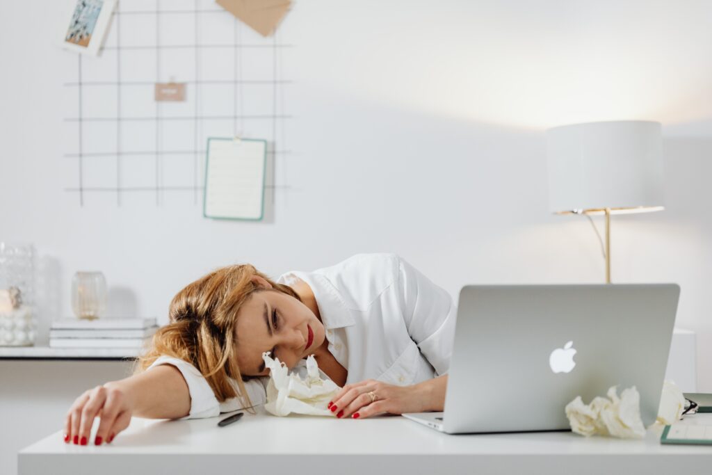 Woman exhausted from social anxiety at work feeling drained after social interactions