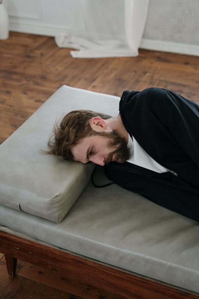 "person experiencing unexplained physical symptoms of anxiety"